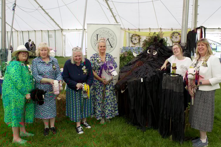 Deborah Custance Baker of Silverton, third from left, appealed for hobby horses for a world record attempt. Also featured is the 'Black Dog' from an old hobby-horse festival at Morchard Bishop