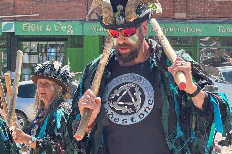 A Lodestone Morris dancer in Crediton Town Square. AQ 2091
