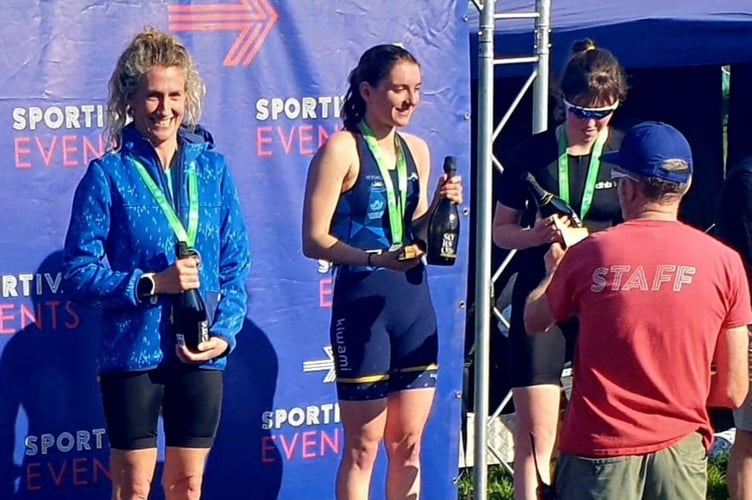 Natalie Rees, left, on podium after coming third in Sportiva's Torbay Spring Sprint Triathlon