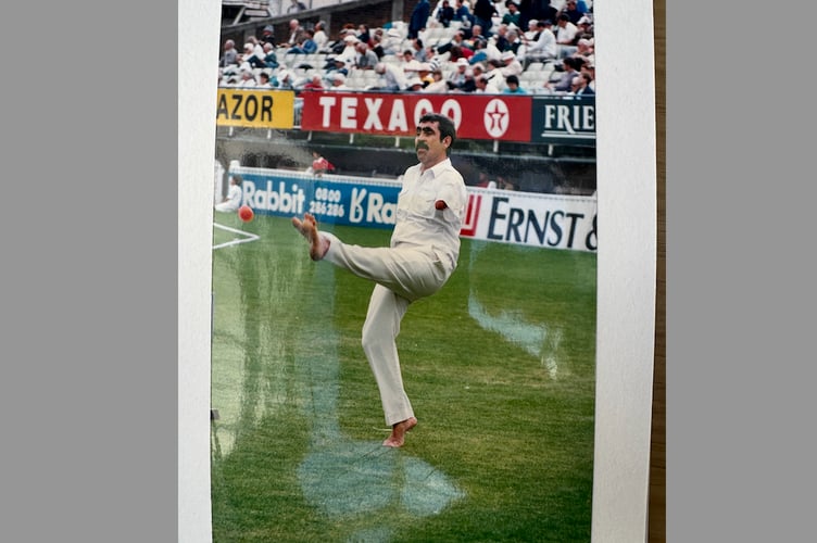 Frank Letch bowling with his feet while playing cricket when he was a young man.