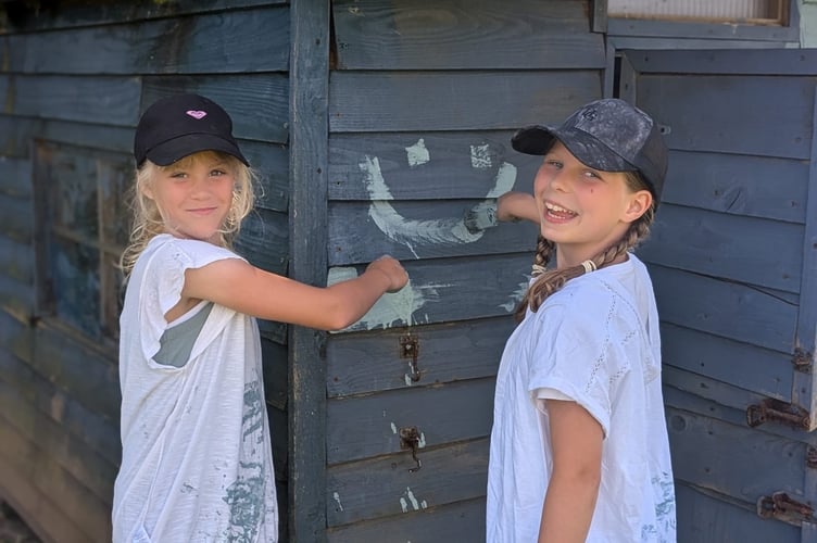 Young volunteers in action at Cheriton Fitzpaine Primary School. 
