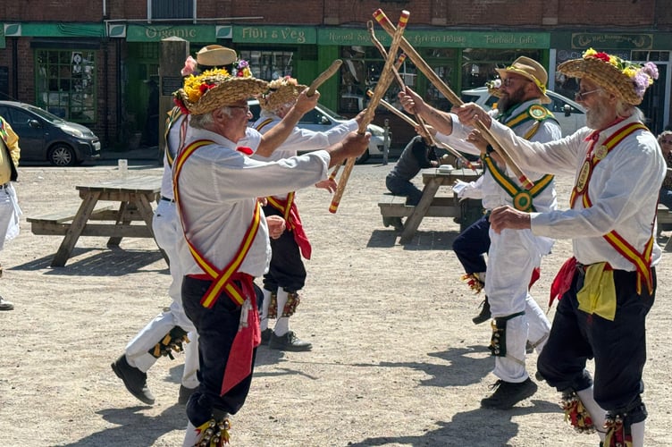 Morris dancers from Carn Brae (Cornwall) and Ripley (Derbyshire) performing in Crediton Town Square. AQ 2073