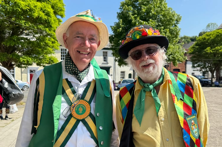 Two Morris dancers in Crediton Town Square.  AQ 2105
