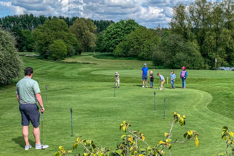 Downes Crediton Golf professional Ollie working with some very junior golfers.
