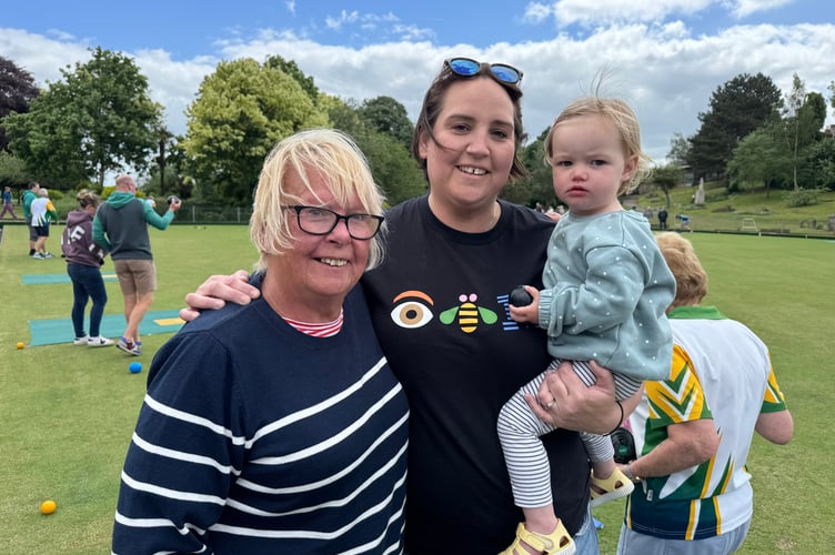 Billie, aged 18 months, enjoyed having a go at bowling, pictured with Emma Peake, centre and her grandmother, Marilyn Carpenter, left. AQ 2687