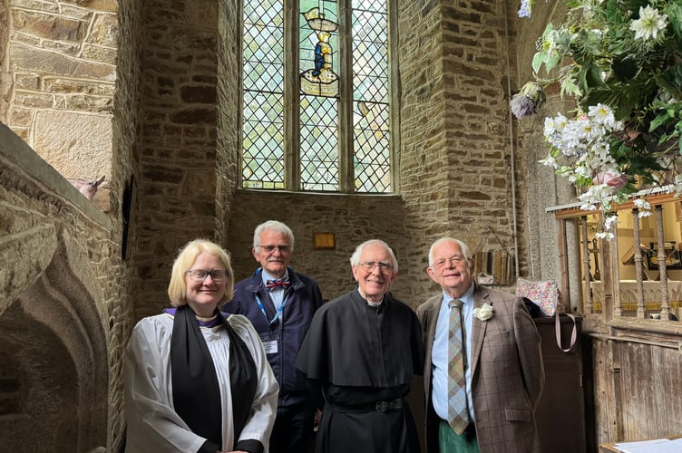 Rev Jo Stobart, the Bishop of Exeter’s Chaplain, left, after she re-dedicated the Edward V window, with, from second left, churchwarden Andrew Green, Rev Preb Peter Rapsey and historian John Dike.  AQ 2553
