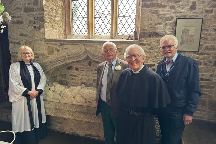 Rev Jo Stobart, the Bishop of Exeter’s Chaplain, left, with, from second left, historian John Dike, Rev Preb Peter Rapsey and churchwarden Andrew Green, beside the tomb of Sir John Evans in Coldridge Parish Church. AQ 2557