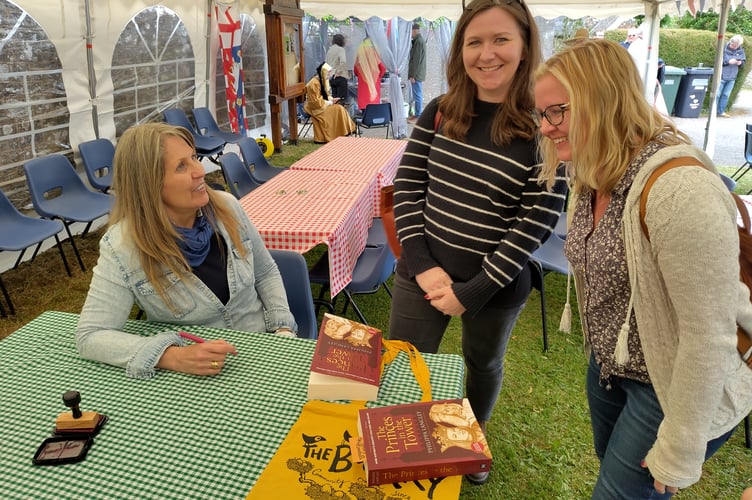 Philippa Langley signing books for Heidi and Anna Robins at Coldridge. Image: The Bookery