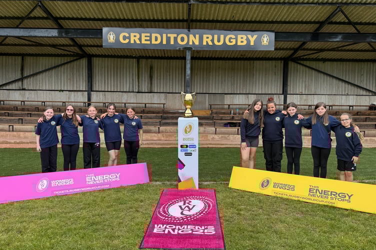 Countess Wear Primary School girls with the Women’s Rugby World Cup trophy. AQ 2338