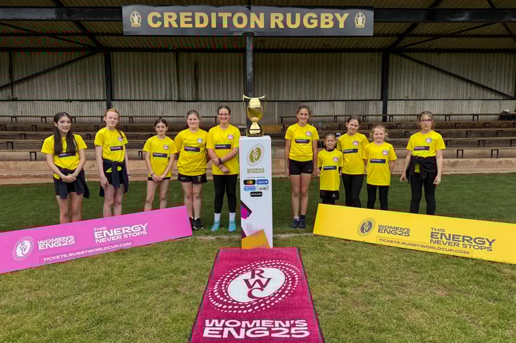 Thorverton Primary School girls with the Women’s Rugby World Cup trophy. AQ 2331