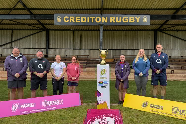 Coaches with the Women’s Rugby World Cup trophy. AQ 2395