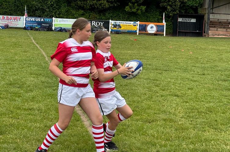 Hayward’s Primary School girls in action during the T1 Rugby Festival at Crediton RFC. AQ 2413