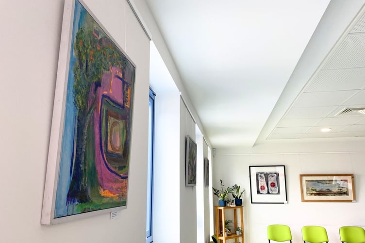 The pair's paintings on display at Redlands' Crediton practice