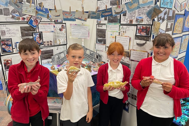 Year four pupils with boats they made