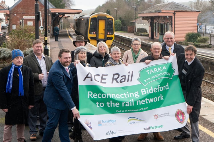 Tim Steer, far right, with campaigners at Crediton railway station