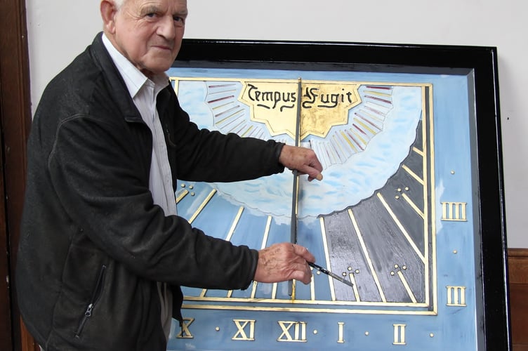 The late Brian Hill who last painted and gilded the sundial back in 2015
