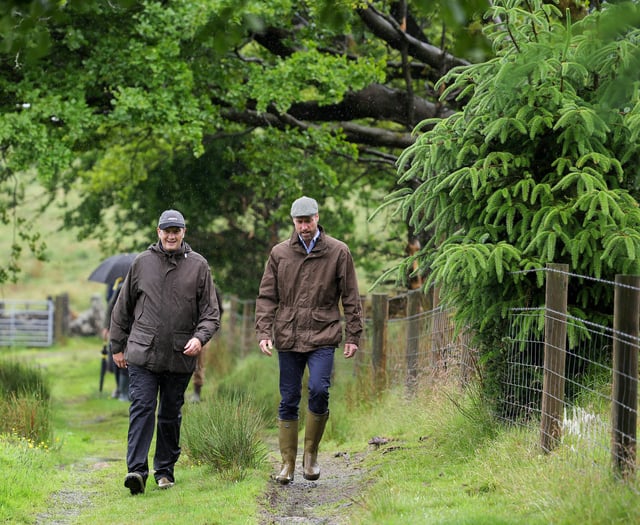 Prince William visits Princetown amid biblical rain