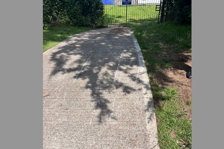 Scratch marks where a tractor was pulled through a gateway at Crediton United FC.