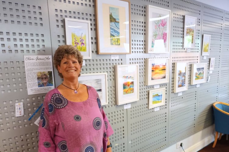 Artist Karen Gutans with her Crediton Library exhibition