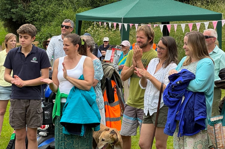 Applause for Linda Lever after she received her gift at Sandford Green. AQ 4672