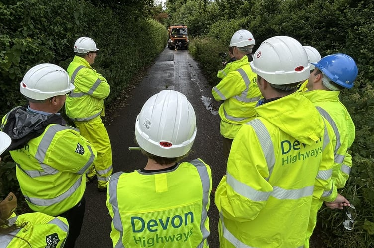 Future of Roads Minister Lilian Greenwood and Devon Highways staff watching a Dragon Patcher.
