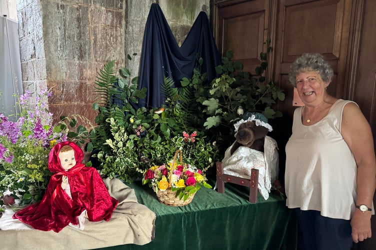 Cathy Allder created a display with flowers about the story of ‘Little Red Riding Hood’.  AQ 4511