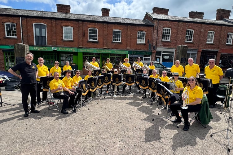 Crediton Town Band during the Afternoon of Music in the Square with Musical Director Iorwerth Pugh, left.  AQ 4253

