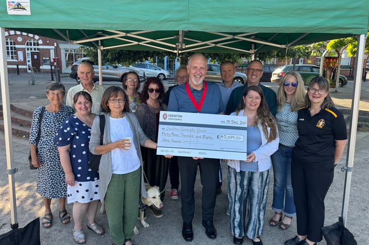 The Mayor of Crediton, Cllr Steve Huxtable, with some of the representatives of local groups which received a share of the Crediton Town Council funding.  AQ 4389 
