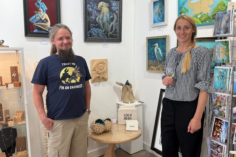 Art Plus Frames owner Monika Przerwa-Tetmajer with co-owner Tom Pawinski beside some of their artworks at Art Plus Frames.  AQ 4591
