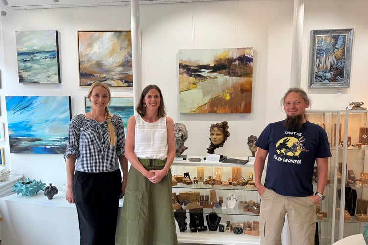 Art Plus Frames owner Monika Przerwa-Tetmajer, left, with artist Belinda Raynell, centre, with Tom Pawinski in the gallery. AQ 4573