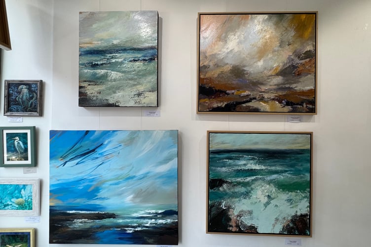 Belinda Raynell with some of her paintings on display at Art Plus Frames.  AQ 4564
