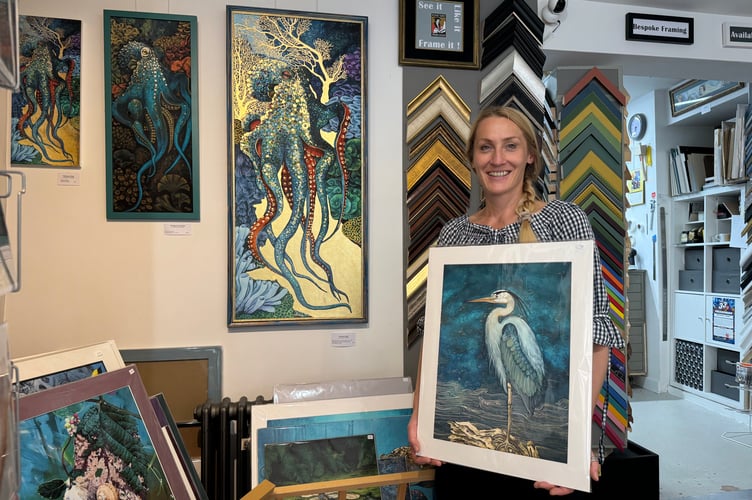 Art Plus Frames owner Monika Przerwa-Tetmajer with some of her paintings. AQ 4596