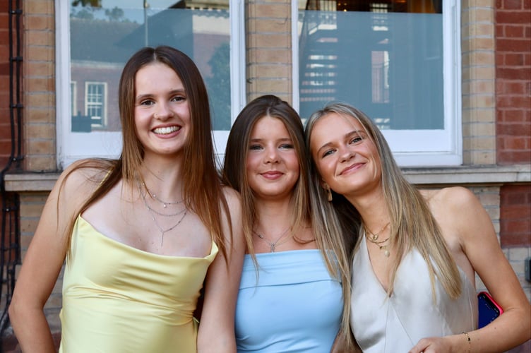 Three friends outside the Rougemont Hotel before the prom
