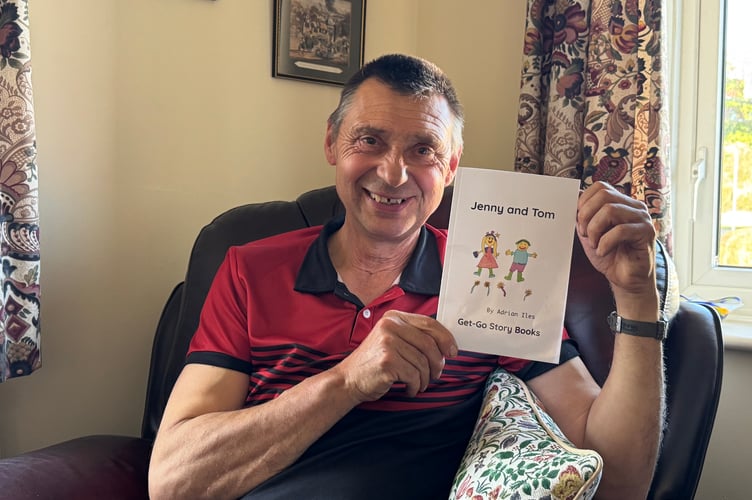 Adrian Isles with a copy of his first children’s book ‘Jenny and Tom’.  AQ 9813

