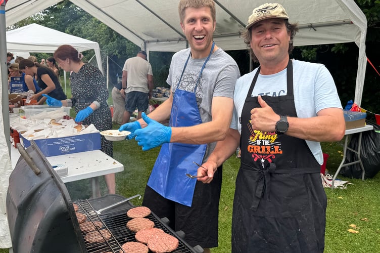 The barbecue was kept very busy. AQ 5148