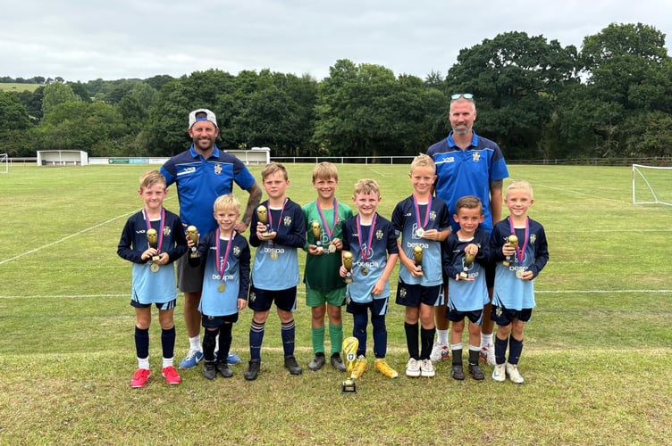 Crediton Puma’s were the U8’s tournament winners, pictured with their coaches Danny Harvey and Richard Groom.
