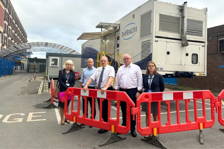 North Devon Lib Dem MP Ian Roome with Lib Dem leader Ed Davey and staff at North Devon District Hospital in front of the modular MRI unit