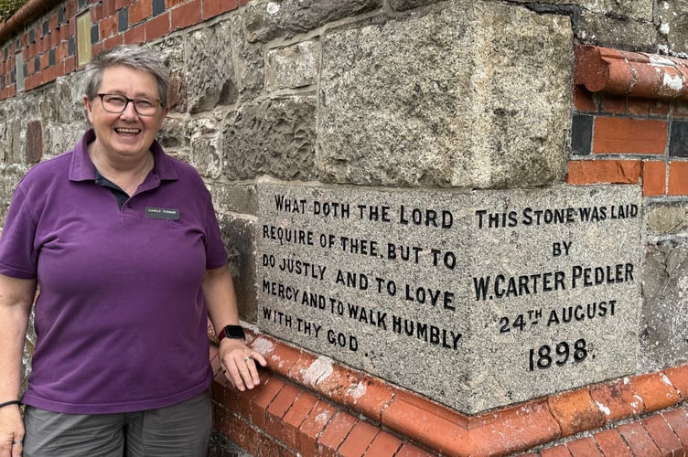 Bow Congregational Church Secretary Carole Thomas beside one of the foundation stones.  AQ 4979
