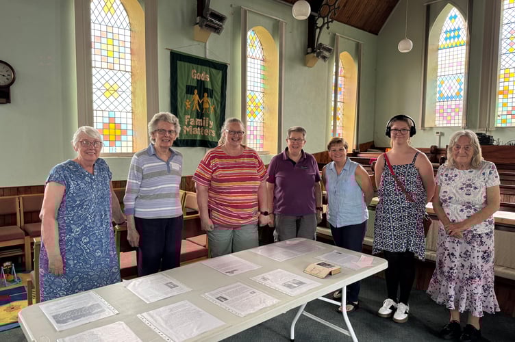 Helpers at a recent display about the history of Bow Congregational Church. It is open again on Saturday, July 5.  AQ 4983
