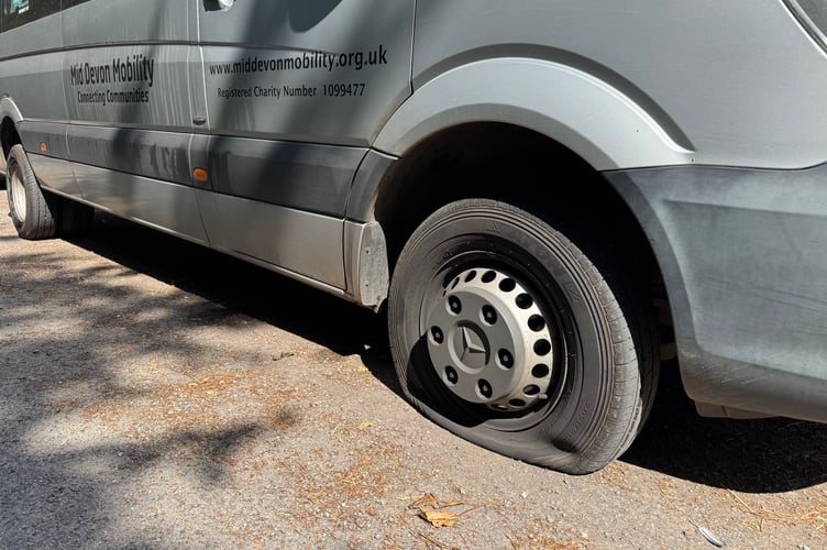A close up of one of the stabbed tyres on the Mid Devon Mobility minibus. AQ 5736