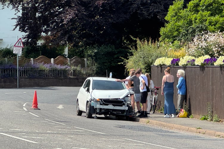 The badly damaged white Peugeot car involved in the collision which is blocking one lane of the road near Tawvale.  AQ 5783