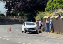 Warning to motorists of car on bend after crash in Crediton