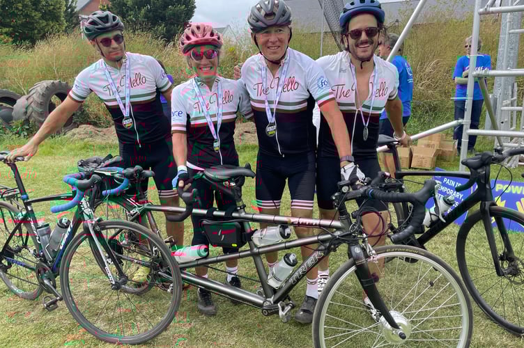 Topsham-based wine, food, and travel writer Marc Millon, pictured with his wife Kim and their tandem, centre, set up The Nello in 2000 to raise money for FORCE Cancer Charity in memory of his great friend Nello Ghezzo. They are pictured with friends after completing the 2025 Nello.