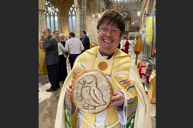 Bishop Moira was given a loaf of bread with a puffin on it, to mark her admission to College of Canons of Exeter Cathedral.