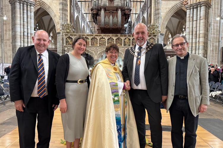 The Mayor of Crediton, Cllr Steve Huxtable, fourth left, shakes hands to welcome the Rt Rev Moira Astin, centre, to her new role, with, left, Crediton Churchwarden Peter Brewer, Crediton Town Clerk Rachel Avery and right, The Rev Preb Matthew Tregenza, Rector of Holy Cross, Crediton.  AQ 6158
