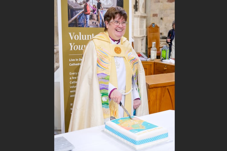 Bishop Moira cut a celebration cake with a map of Devon on it following her Installation as Bishop of Crediton.
