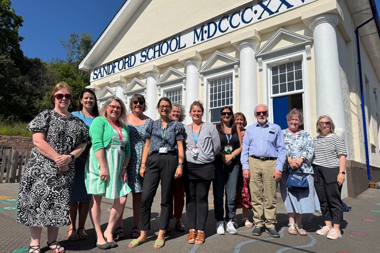 Some of the current and former school staff at Sandford School’s 200th anniversary celebration with Head of School Hannah Fee, fifth left.  AQ 5537
