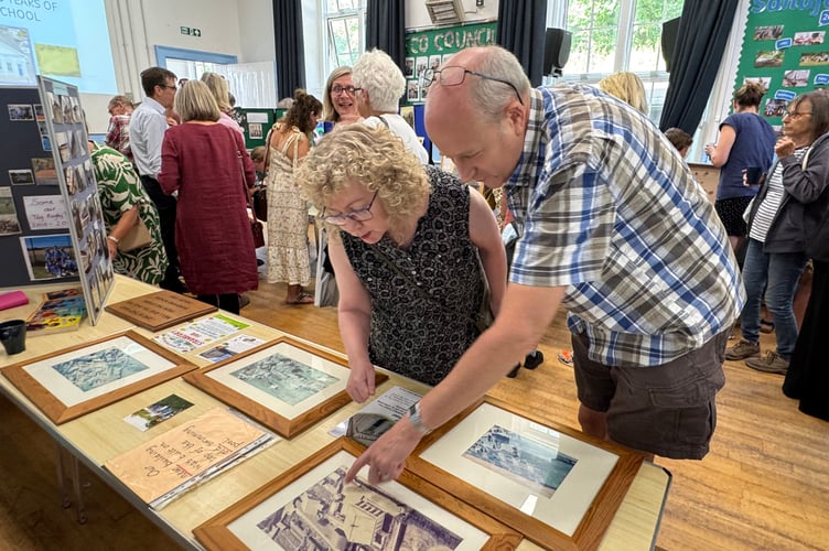 Looking at old photos brought back memories for former Sandford School pupils Carol Furze and Dave Sims.  AQ 5531
