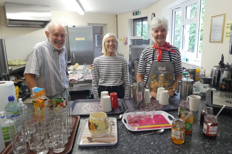 Jonathan Berg, Wendy Wilson and Jenny Berg serving refreshments in Cheriton Fitzpaine Parish Hall