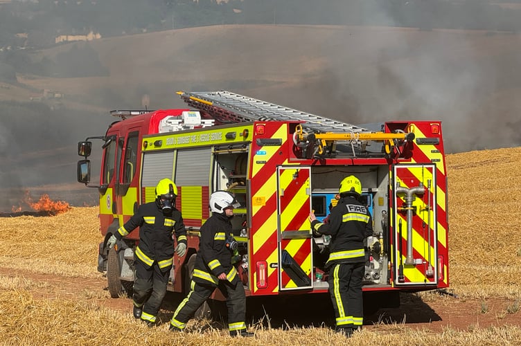 A fire crew at the scene of the Crediton field fire. AQ 6593